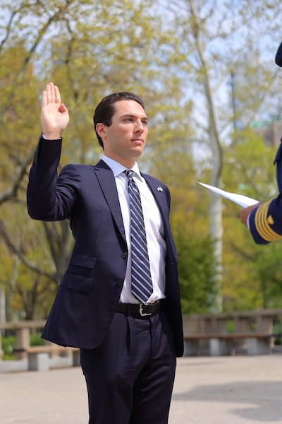 NEW YORK CITY — Ensign Michael Barth conducts his enlistment oath in front of friends and family on May 3, 2022, at the Battery Park World War II Memorial. Coast Guard Photo by Daniel Henry