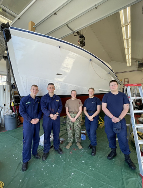 CHATHAM, MA – Massachusetts Maritime Academy AUP Cadets Mitchell Campbell, Jacob Bolles, Alexa Smith, Abigail LeLievre, and Cole Francavilla pose in front of retired Motor Life Boat CG 36500 during spring commissioning work. The cadets learned more about the history of the boat and the Pendleton Rescue made famous by the Disney movie, "The Finest Hours" and then painted the entire hull including the bottom and topsides. Photo by U.S. Coast Guard Auxiliarist Lisa Goodwin